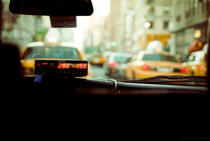 inside of a cab, dashboard showing meter