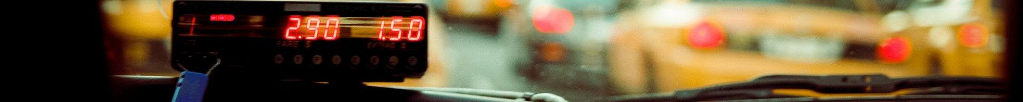 inside of a cab, dashboard showing meter