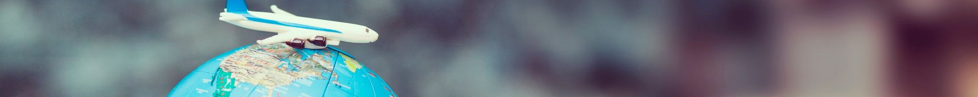 toy plane on a world globe